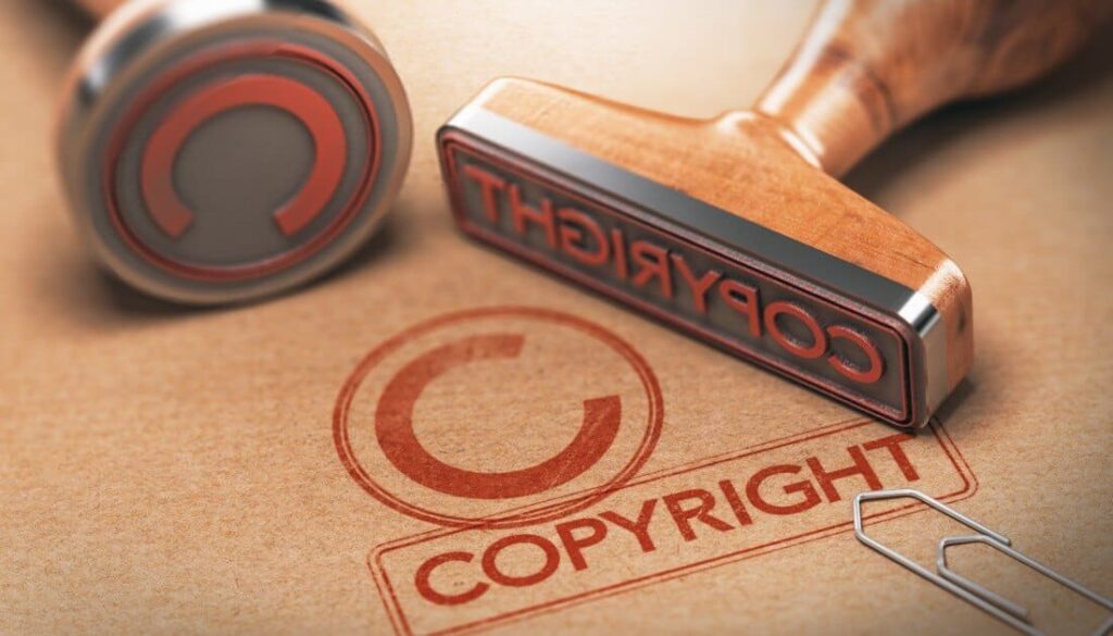 AI copyright: Two stamps labeled "Copyright" and "C" with wooden handles and red ink.
