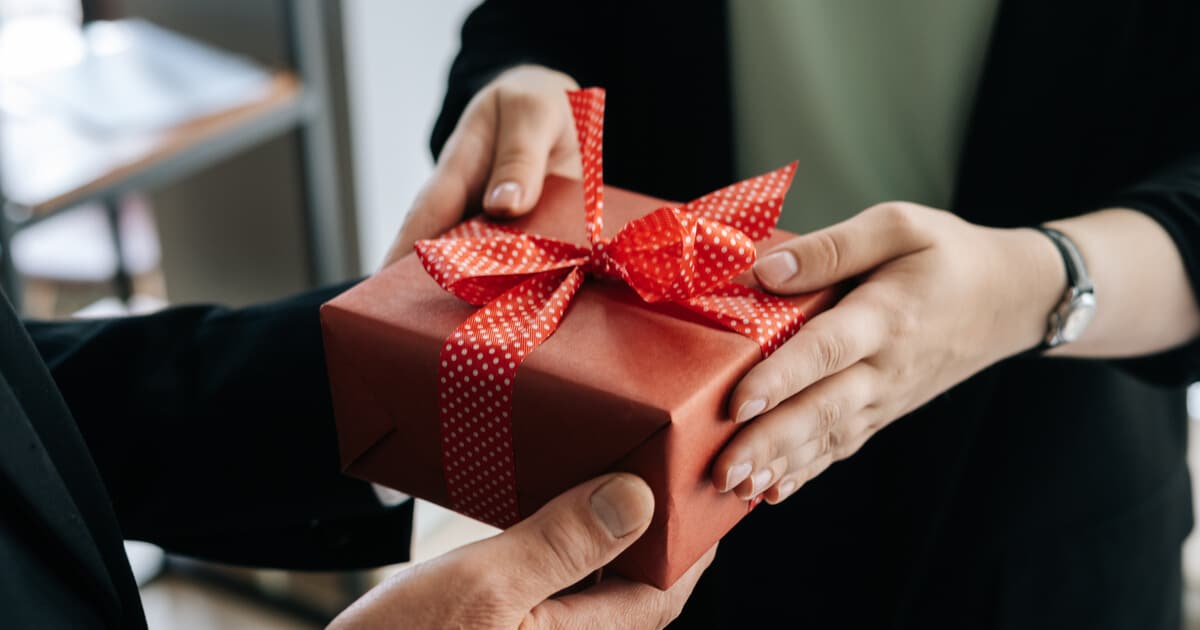 Person is giving a gift to another and is mindful of the lifetime giving tax exclusion.
