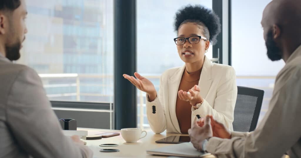 A Woman consults with a small business attorney as she attempts to make sense of FinCEN real estate rule news.