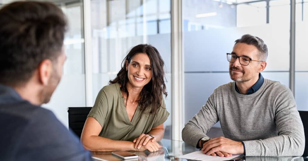 An older couple meets with a lawyer to consider a postnuptial agreement.