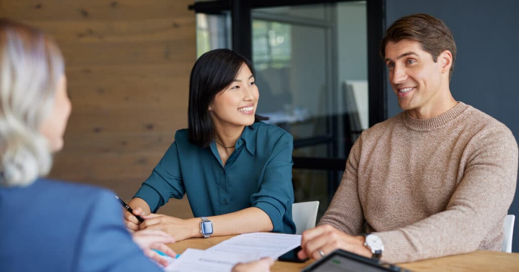 A young couple meets with a lawyer to talk about a prenuptial agreement in California.