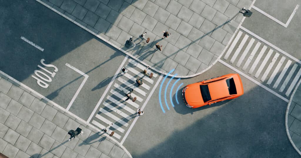 A self driving car driving just feet from pedestrians reminds us that a self driving car accident attorney may become increasingly helpful as accidents happen.
