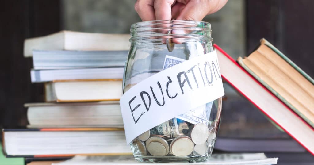 Money in a jar labeled education reminds us that the new federal school choice tax credit unlocks new education funding.