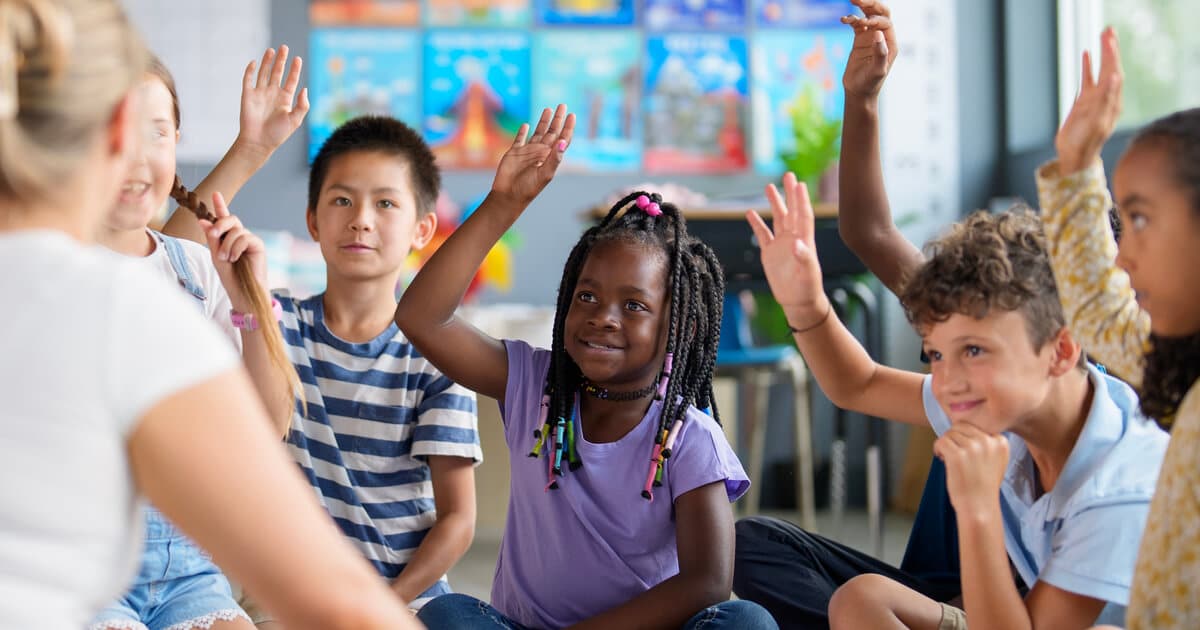 A diverse group of students eagerly participates in their tutoring program, made possible by funding from the new federal SGO tax credit.