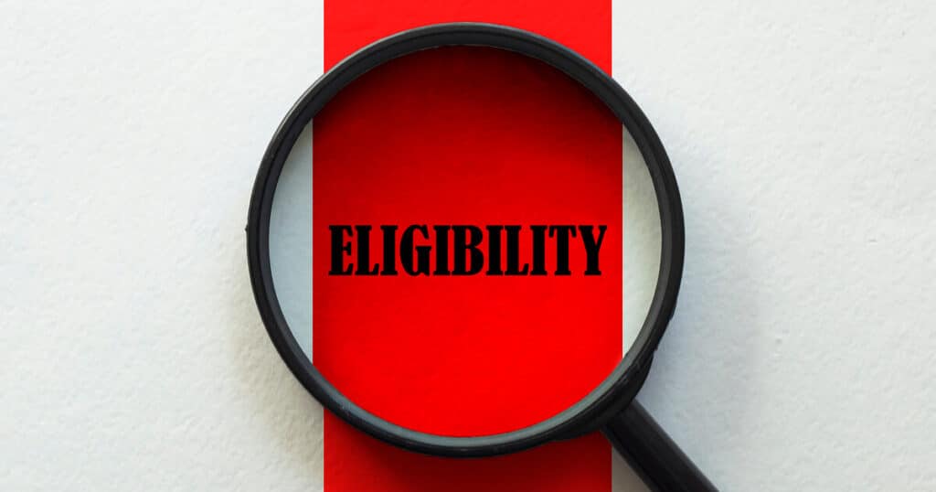 A mangifying glass on the word eligibility highlight the factors that may mean a taxpayer is eligible for an irs covid penalty refund.