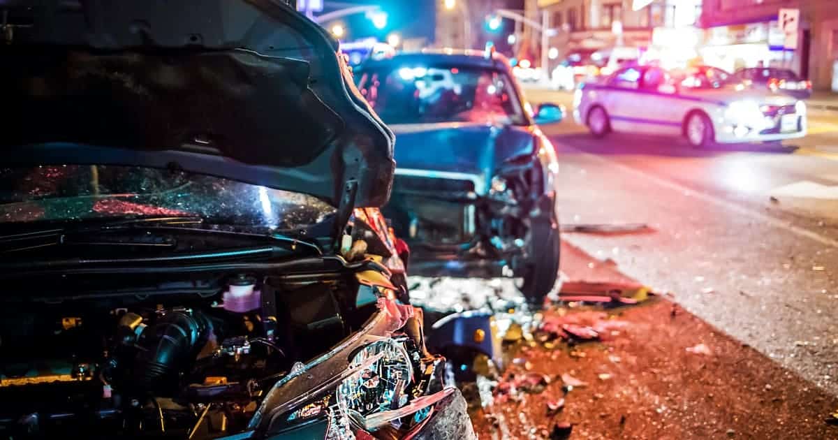 2 cars in a city are severely damaged after a car accident no insurance not at fault scenario. Auto accident attorneys at Gammon & Grange can help.