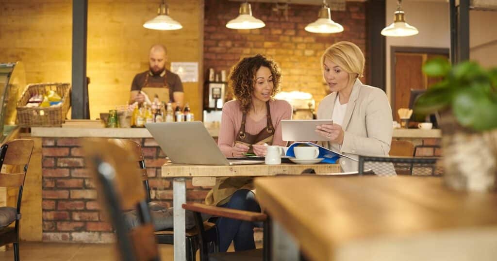 A business tax attorney helps a small business owner, asking, "How fast can I form an LLC in CA?"