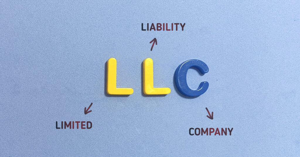 Plastic letters LLC and arrows to words explain what an LLC is in a blog answering the question, "How do I form an LLC in California?"